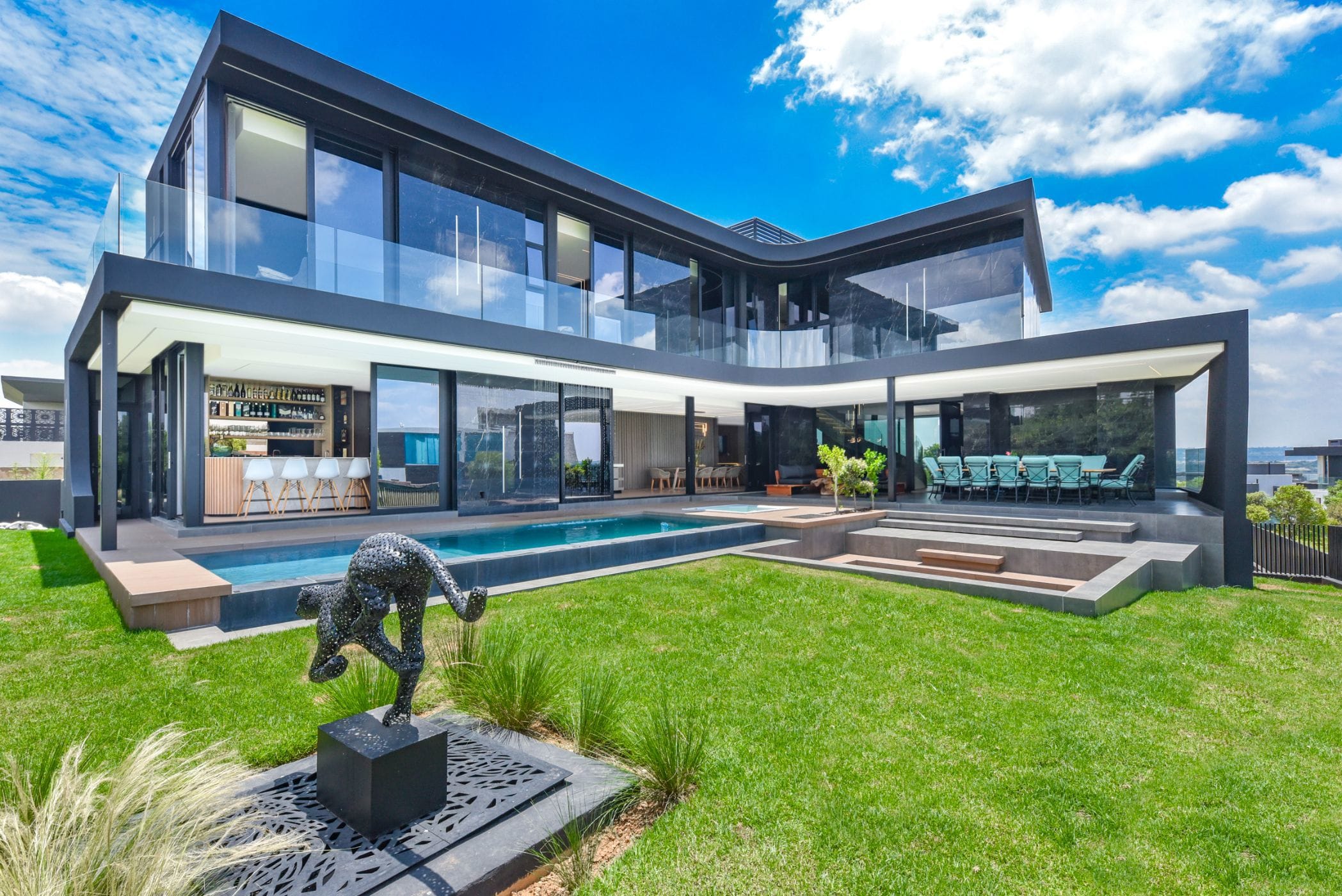 Modern eco-friendly South African estate home with solar panels and secure outdoor entertainment area