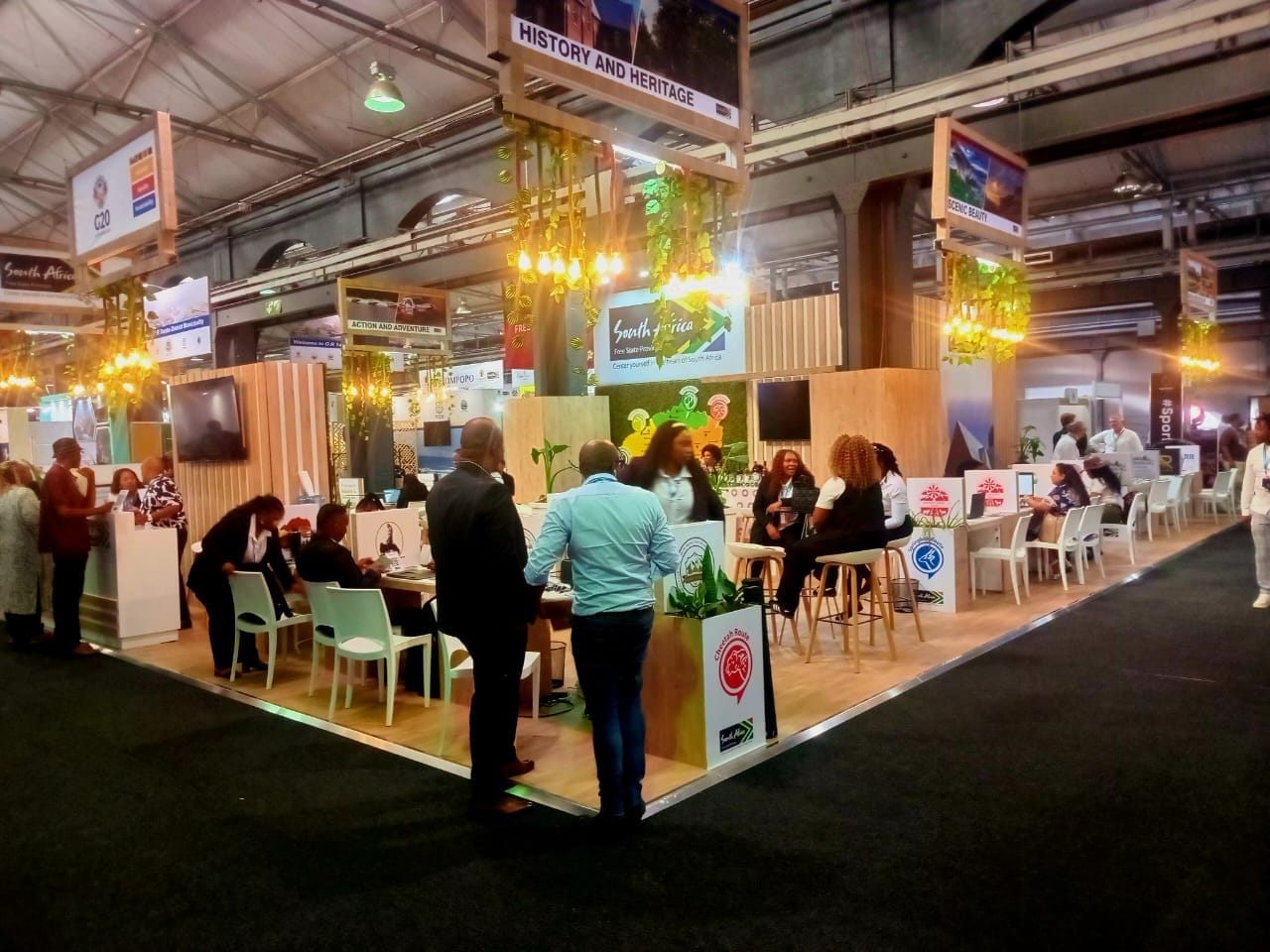Crowded exhibition hall at a major South African property and home expo with modern stands and displays